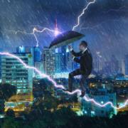young-professional-with-umbrella-in-storm-overcoming-challenges-and-crisis-concept-mix-SBI-301985594